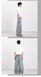 Détail d'un pantalon rayé pour homme avec un tombé fluide et une coupe droite élégante