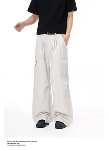 Detailed view of the large cargo side pocket on men's lightweight wide-leg pants