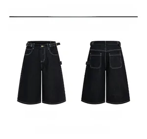 Detail of black wide-leg carpenter denim shorts with high contrast white stitching