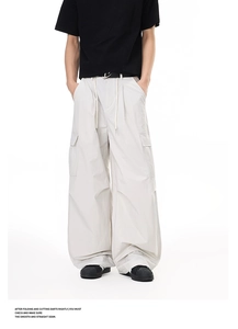 Detail of lightweight cargo pants showing quick-dry fabric texture and pocket stitching
