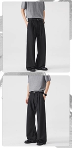 Detail of black wide-leg trousers showing pleated design and premium draped fabric texture
