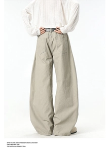 Detail view of khaki wide-leg utility pants with symmetrical rear cargo pockets