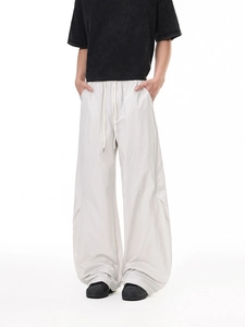 Men's loose cargo pants in light grey nylon fabric with elastic waist and drawstring
