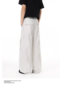 Detailed back view of lightweight men cargo pants featuring side flap pockets and wide leg cut