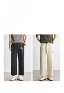 Relaxed straight-leg textured trousers in black and off-white for versatile daily wear