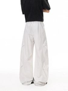 Men's loose fit white cargo pants with elastic waist and wide leg utility style