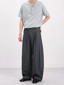 Mens vintage striped wide-leg pants and grey henley shirt for business casual style