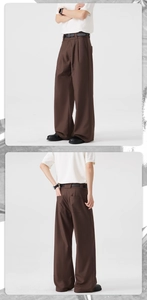 Detail view of brown wide-leg trousers showing pleated texture and premium drape effect