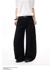Detail of cargo wide-leg pants featuring multi-pockets and cotton twill texture