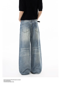 Detailed rear view of light blue wide-leg jeans with vintage whiskering and back pockets
