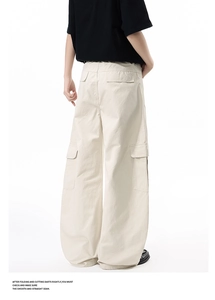 Rear view of beige wide-leg cargo pants showing back flap pockets and durable cotton fabric
