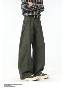 Detailed view of dark green cargo pants featuring premium stitching and durable twill fabric