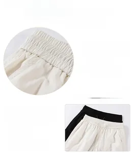 Detail view of adjustable elastic waistband with drawstring on casual straight-leg pants