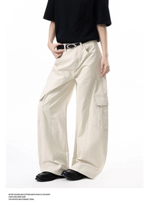 Detailed view of cargo pants featuring large side pockets and premium cotton fabric