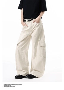 Detailed view of off-white wide-leg cargo pants with large flap pockets and relaxed fit