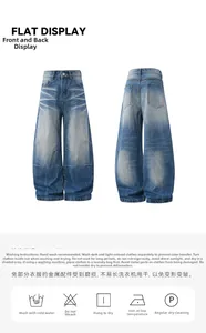 Flat lay of retro washed flared denim jeans with whiskers and curved leg design