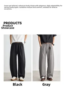 Vue détaillée du pantalon décontracté noir et gris à jambes larges avec plis à la taille