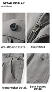 Détail de pantalon décontracté gris montrant le bouton, le zip et les coutures de poche