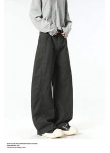 Detail view of heavy-duty workwear trousers with contrast stitching and large cargo pockets