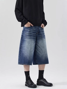 Men's loose fit deep blue washed denim shorts with vintage cat whisker texture