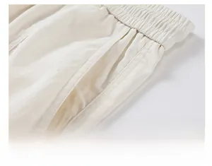 Detail of slant pockets and reinforced stitching on light beige Lyocell casual trousers