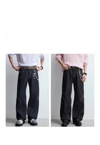 Jean en denim à jambe large pour hommes en bleu et noir avec empiècements et surpiqûres