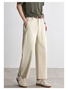 Side view of men's cream textured trousers with a premium drape and wide-leg fit