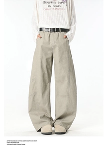 Close-up of khaki wide-leg cargo pants fabric texture with decorative side stitching