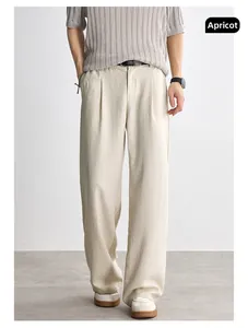 Close-up of beige Lyocell tencel fabric texture on wide-leg casual athletic pants