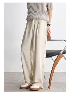 Close-up of light beige Lyocell casual trousers with a textured, breathable fabric
