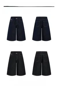 Detail view of American style loose denim shorts in deep blue and black finishes