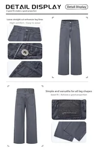 Detail view of high-waist loose straight jeans in dark grey with leather patch and pockets