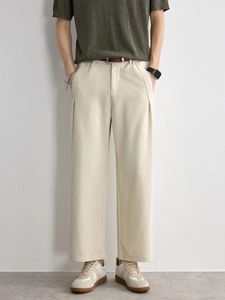 Men's relaxed fit straight-leg trousers in beige with pleated texture and brown belt