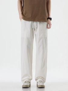Men's loose white lyocell straight leg trousers with drawstring waist and fluid drape