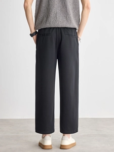 Men's black straight-leg trousers with elegant drape texture and classic back pocket design