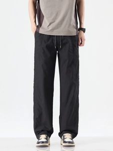 Men's loose white casual pants in quick-dry ice silk fabric with drawstring waist