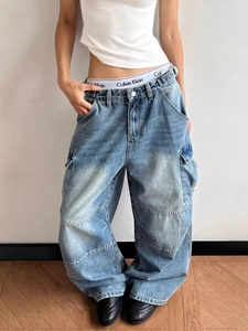 Vintage high street multi-pocket baggy cargo jeans in washed blue denim fabric