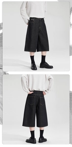 Front and back view of loose fit black denim wide-leg shorts with five-pocket design