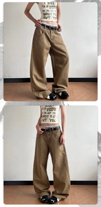Detail view of khaki baggy streetwear trousers with relaxed fit and premium fabric texture