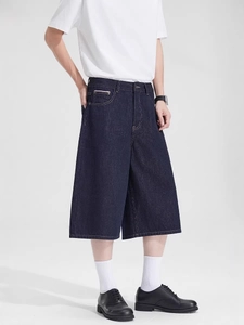 Men's deep blue wide-leg denim shorts in cleanfit style with contrast stitching details