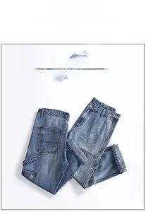 Detail view of men's slim fit jeans with distressed denim texture and cargo pocket