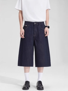Men's deep blue wide-leg denim shorts in cleanfit style with classic five-pocket design