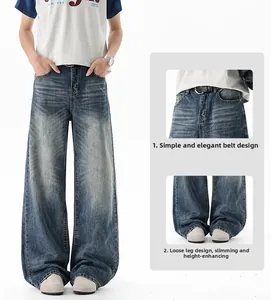 Detail of high-waisted denim waistband and wide-leg cuff on retro washed blue jeans