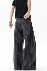 Rear view of dark grey striped wide-leg trousers with elegant drape and relaxed fit