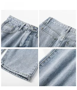 Gedetailleerde weergave van lichtblauwe denim met metalen knoop, rits en strakke naden