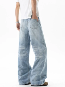 Men's vintage light blue wide-leg jeans with whiskered wash and straight fit cut