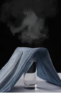 Breathability test showing steam passing through blue denim jeans fabric for comfort