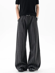 Men's charcoal grey wide-leg trousers with vertical stripes and a minimalist belt