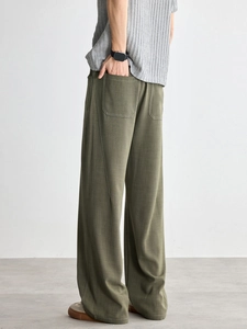Pantaloni larghi verde militare da uomo con cuciture a contrasto e vestibilità dritta