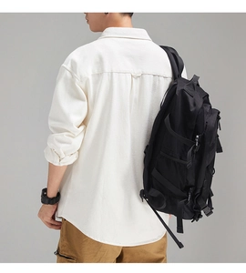 Rear view of tactical black backpack with reinforced straps and mesh side pockets
